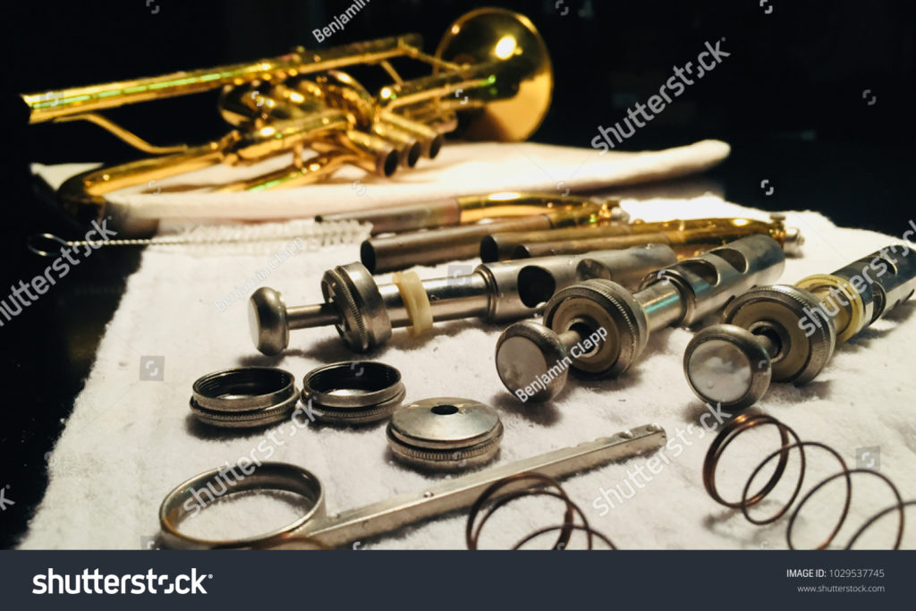 stockphotobrasstrumpetpieceslayoutduringinstrumentcleaningand